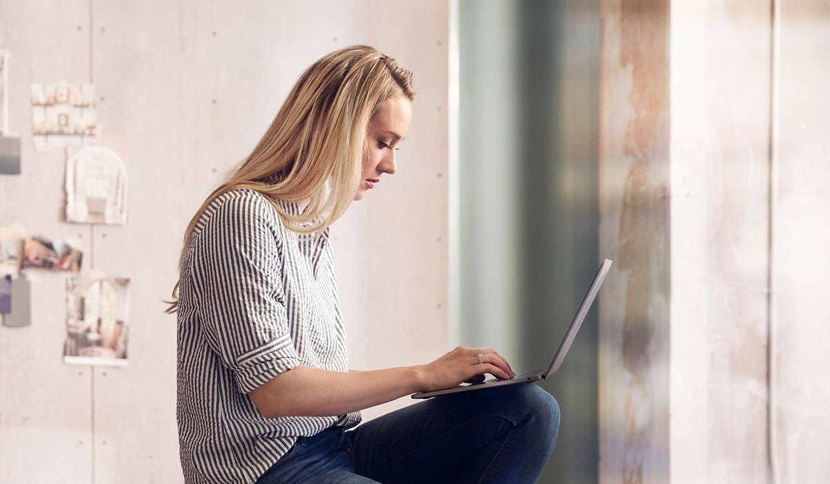 A shopper calculating her monthly payment and trade-in value all in one place streamlining her buying experience.
